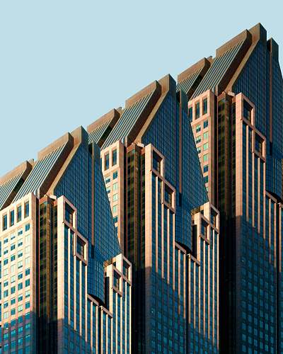 office building three blue-and-white high rise building under blue sky condo